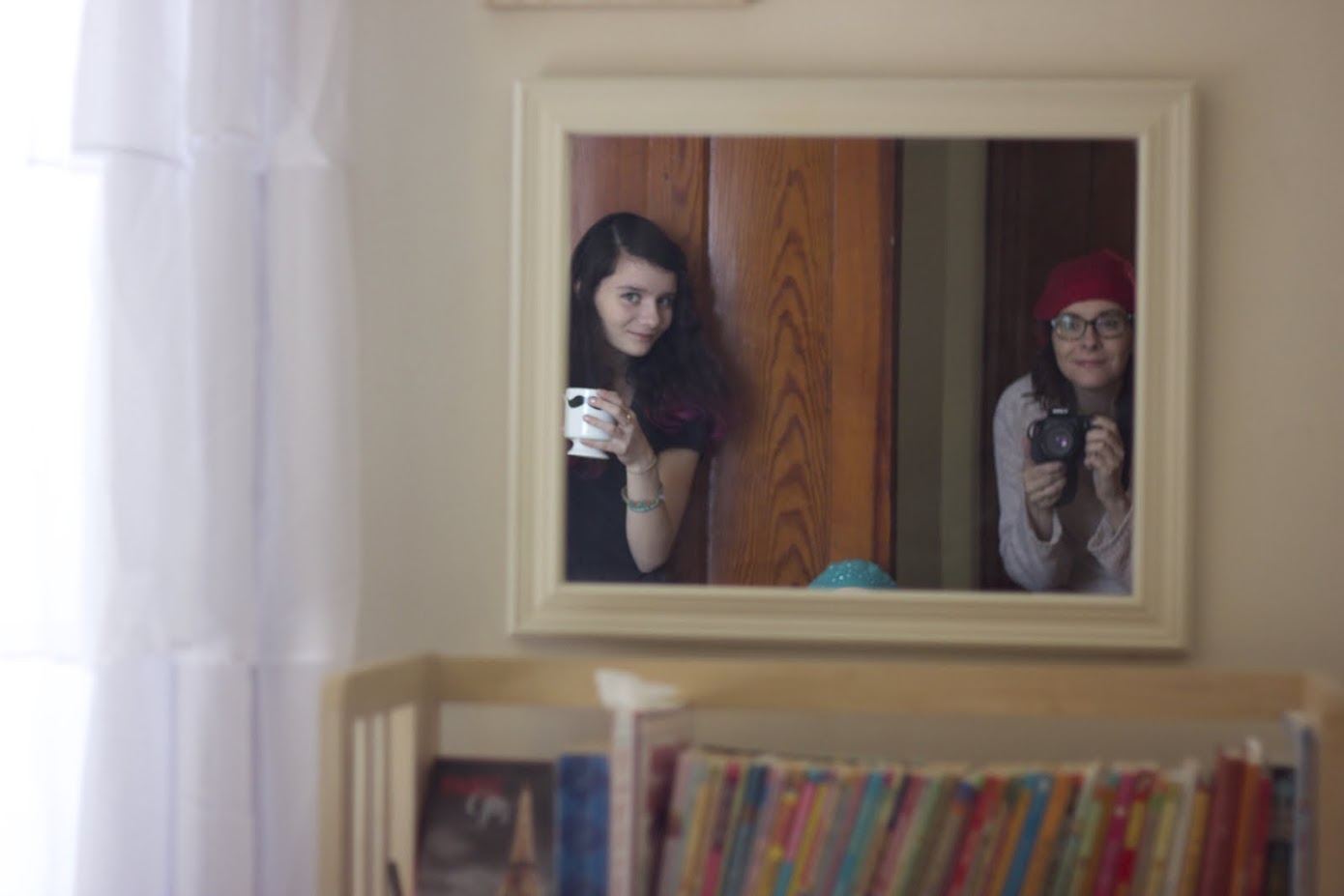 reflection of two girls in the mirror