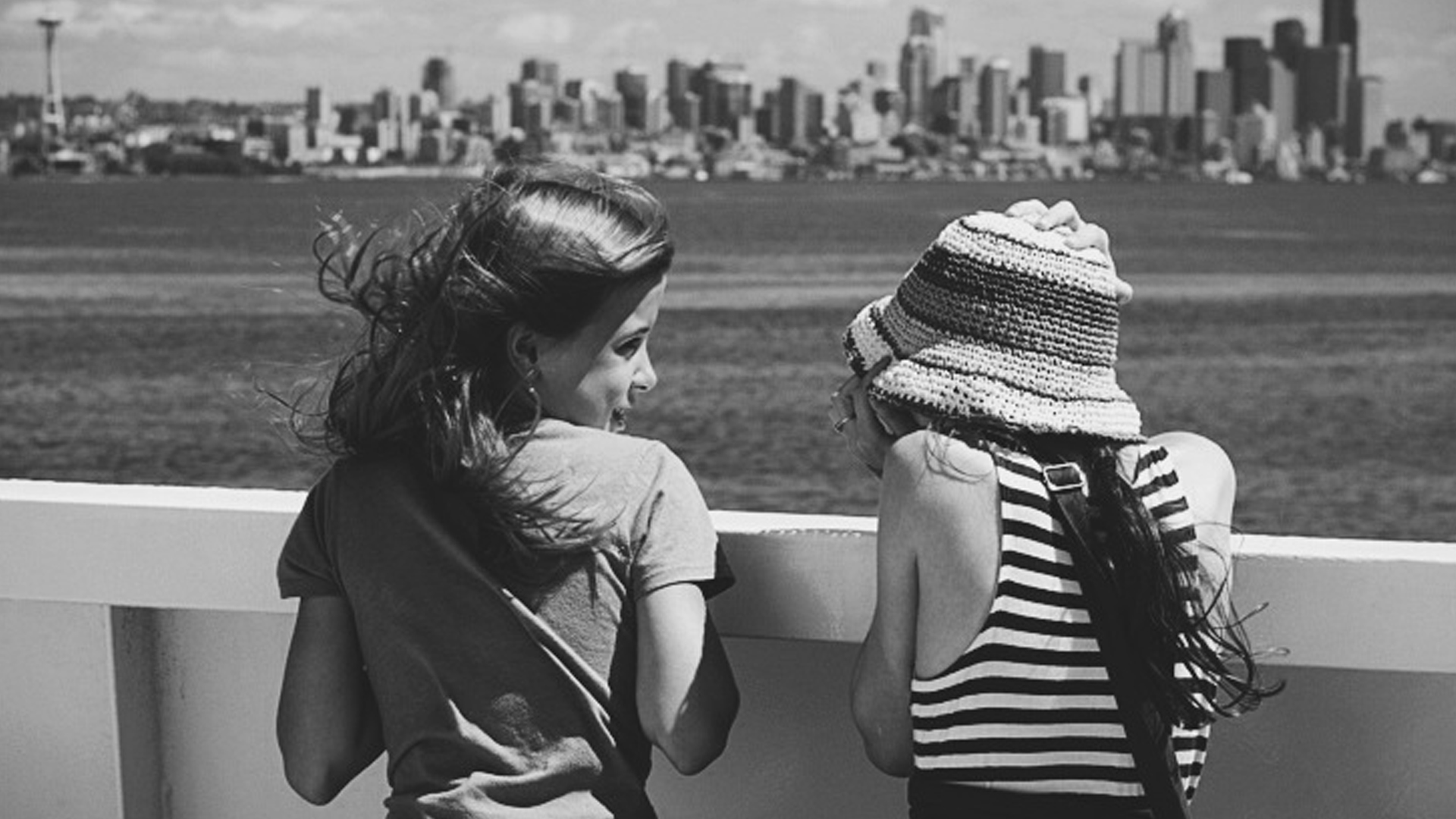 Two girls talking on the ferry