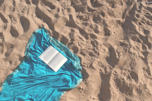 Open book on the sand