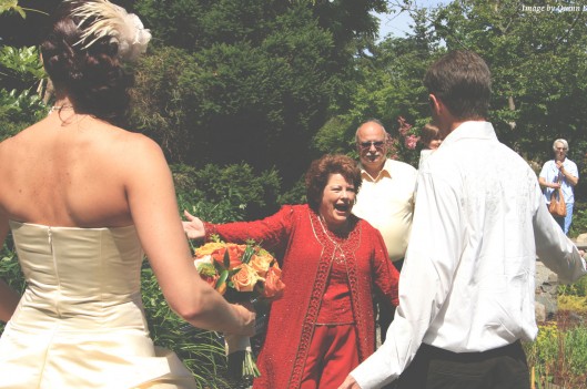 mother in law greeting son at wedding