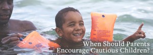 Young boy swimming | When Should Parents Encourage Cautious Children?
