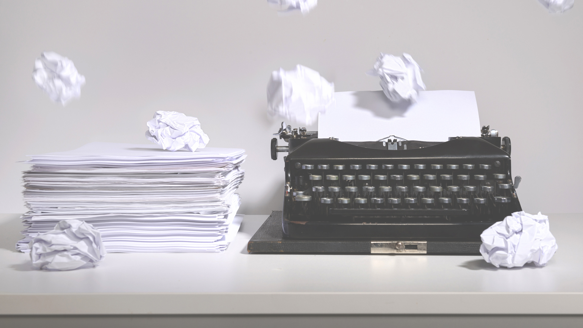 typewriter and sheets of paper