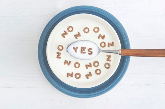 Cereal bowl with letters forming yes and no