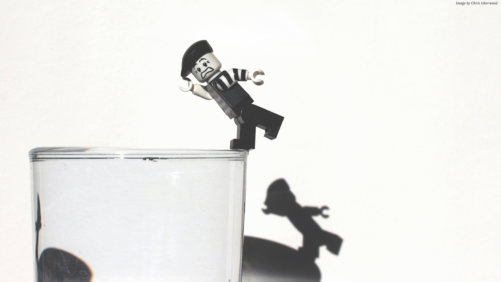 Lego mime falling into a glass of water