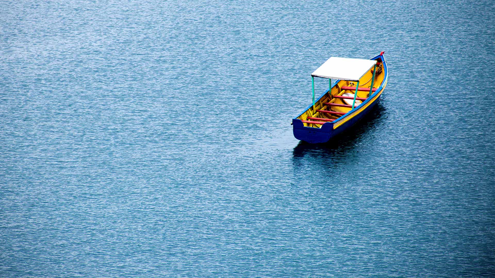 Photo of an empty skiff on water