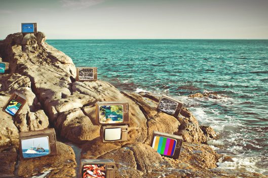 TVs on beach rocks
